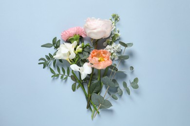 Different beautiful flowers on light background, flat lay