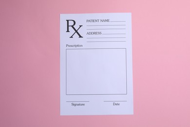 Medical prescription form on pink background, top view