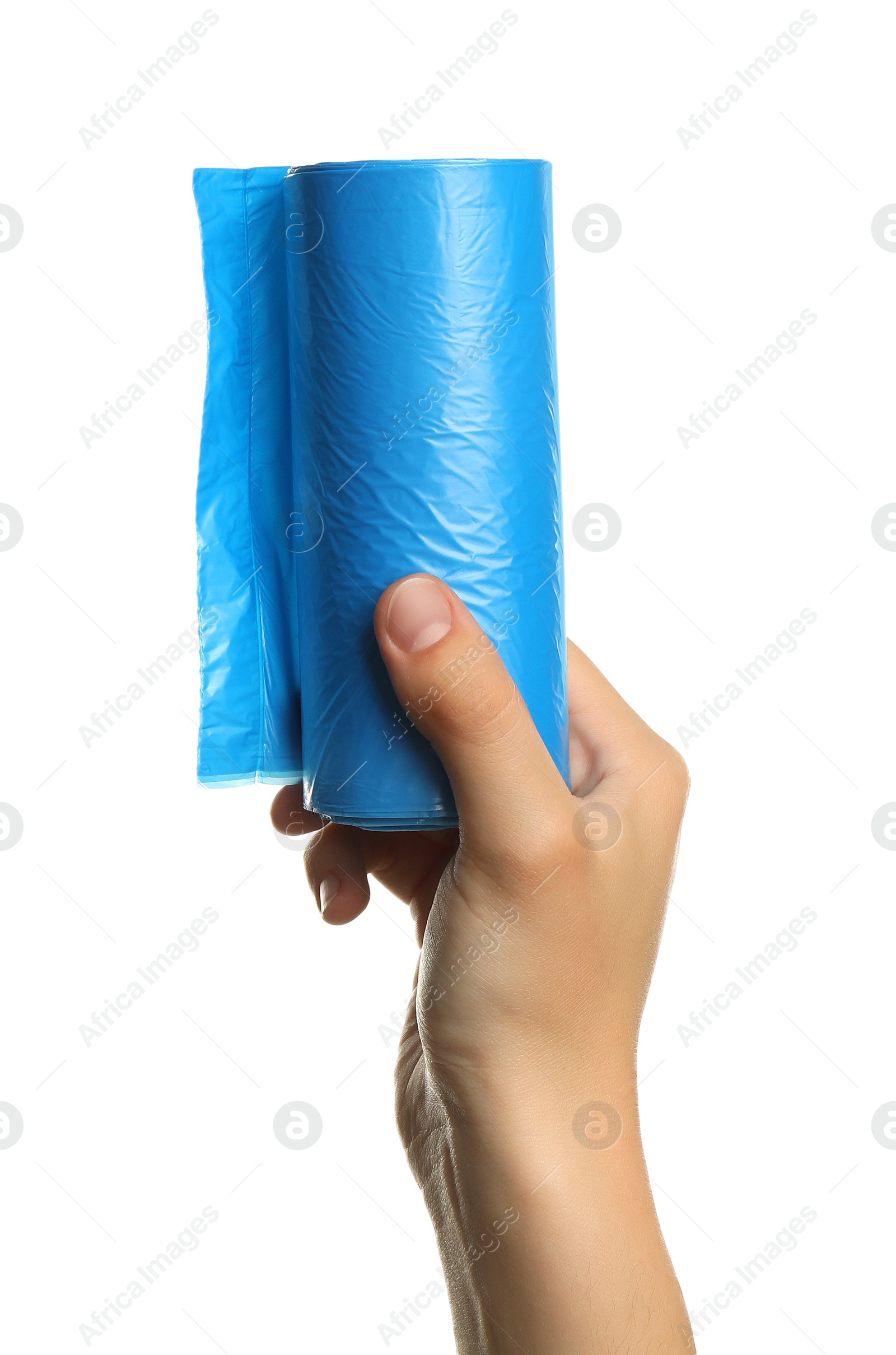 Photo of Woman holding roll of turquoise garbage bags on white background, closeup. Cleaning supplies