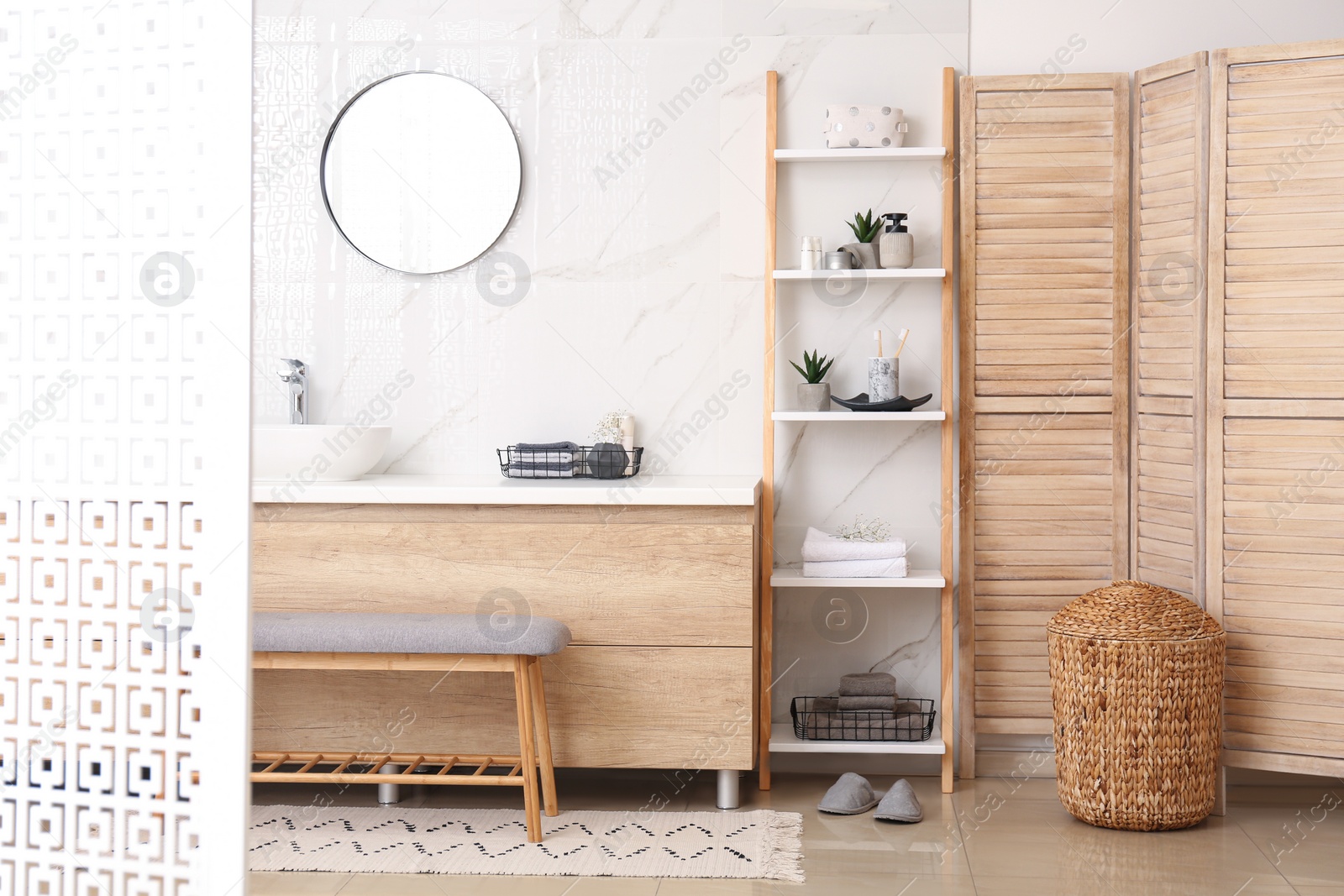 Photo of Modern bathroom interior with decorative ladder near countertop