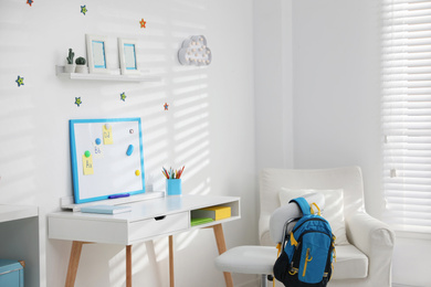 Photo of Modern child room interior with stylish furniture