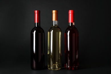 Bottles of expensive wines on dark background