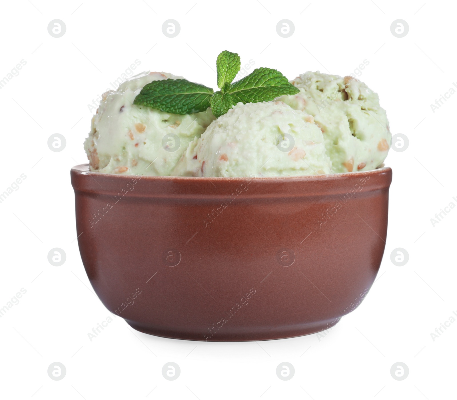 Photo of Delicious pistachio ice cream with mint in bowl isolated on white