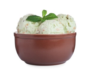 Photo of Delicious pistachio ice cream with mint in bowl isolated on white