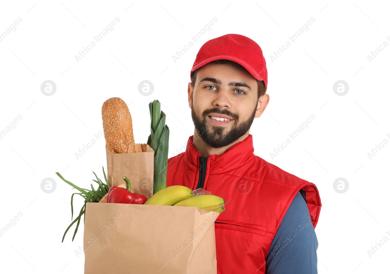 Photo of Man holding paper bag with fresh products on white background. Food delivery service