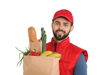 Man holding paper bag with fresh products on white background. Food delivery service