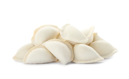 Photo of Heap of raw dumplings on white background