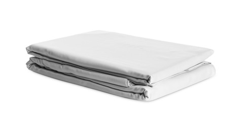 Photo of Stack of clean silky bed linen isolated on white