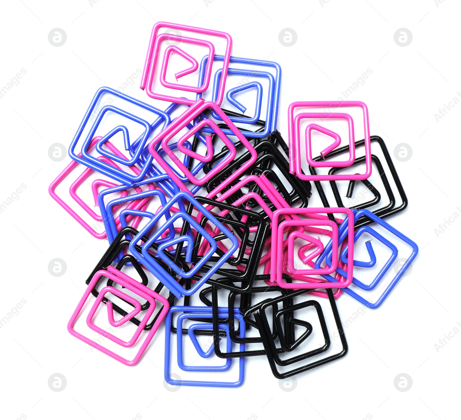 Photo of Heap of paper clips on white background. School stationery