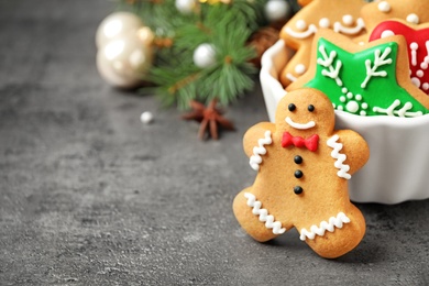 Photo of Tasty homemade Christmas cookies on grey table, closeup view. Space for text