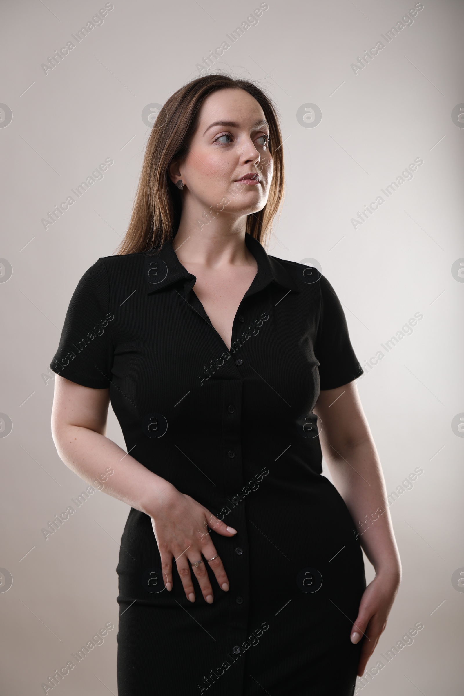 Photo of Portrait of beautiful woman on gray background