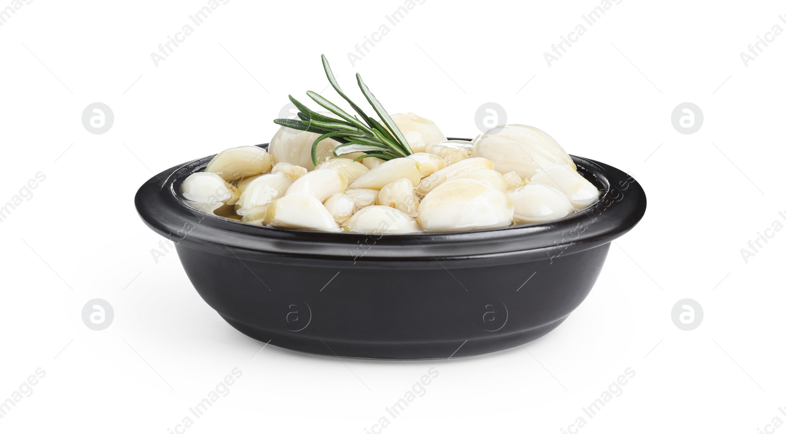 Photo of Peeled garlic cloves with honey and rosemary in bowl isolated on white