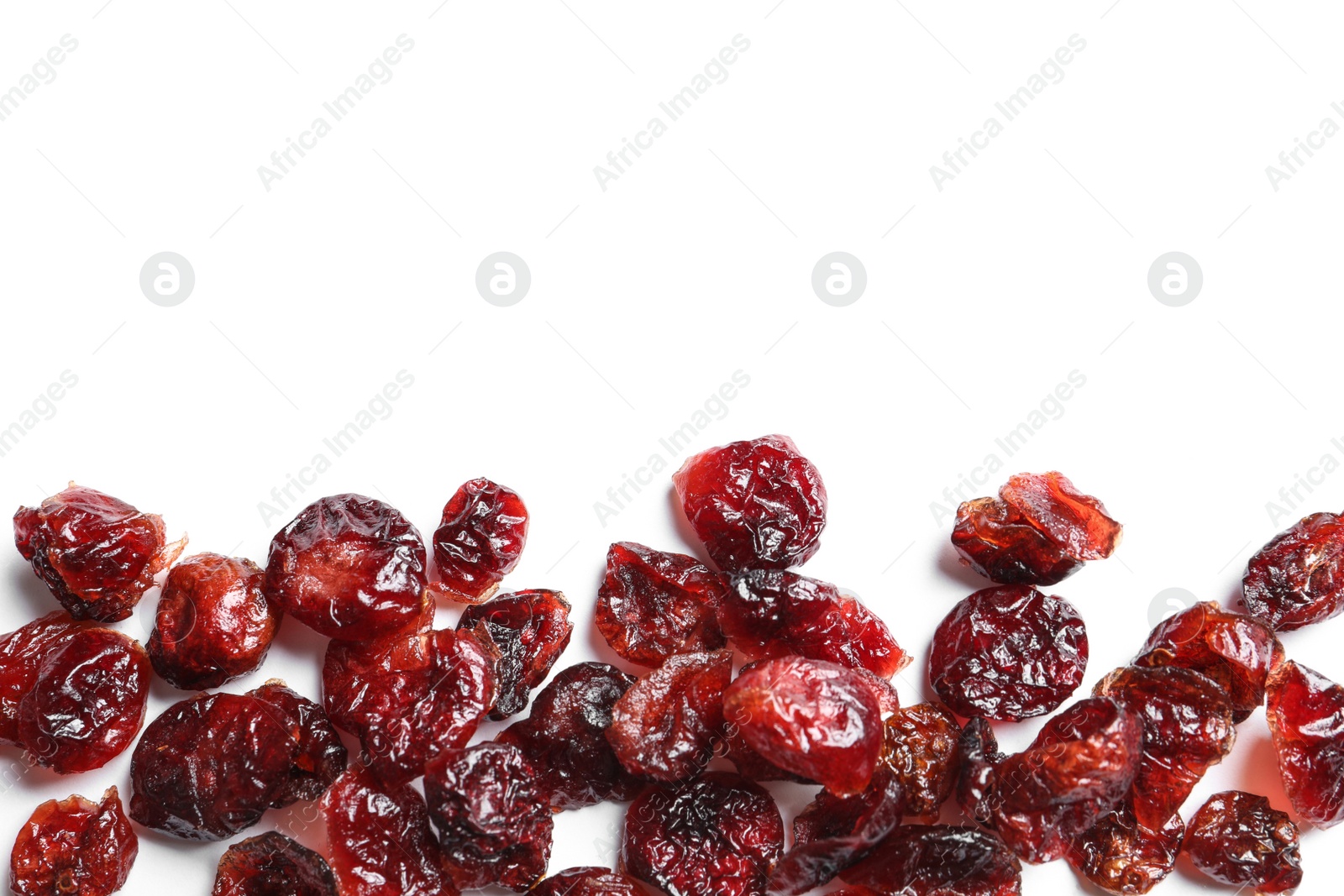 Photo of Cranberries on white background, top view with space for text. Dried fruit as healthy snack