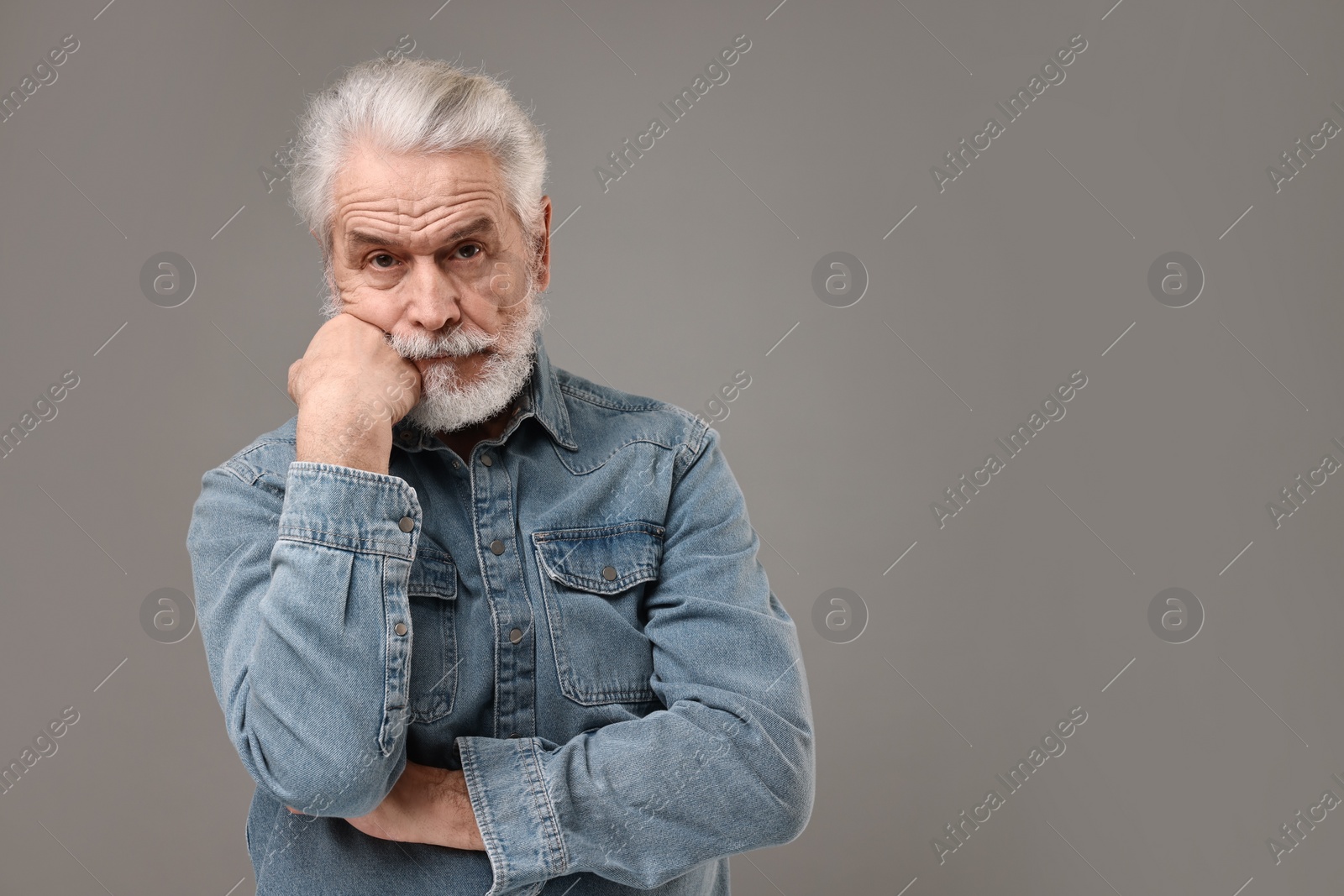 Photo of Senior man with mustache on grey background, space for text