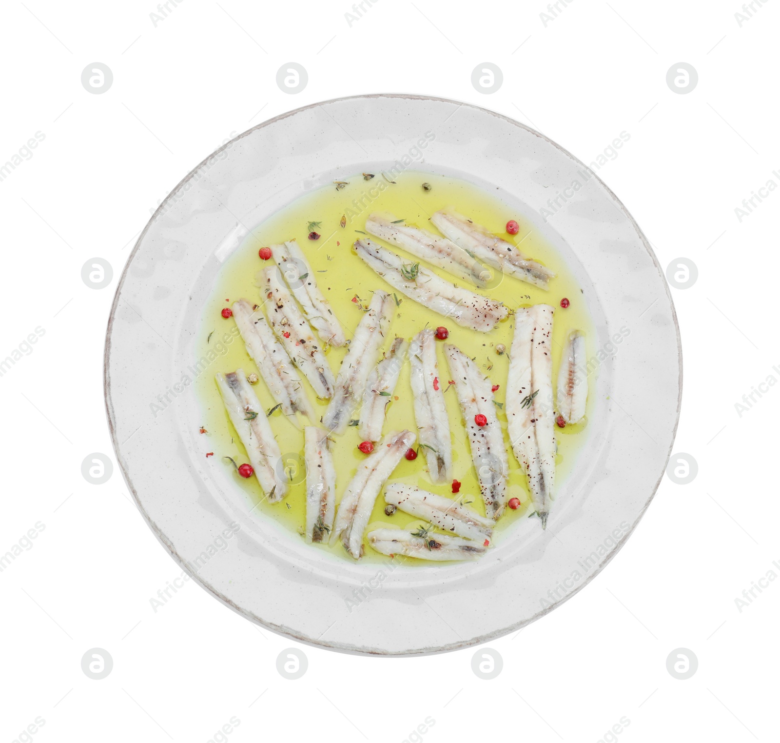 Photo of Tasty pickled anchovies with spices isolated on white, top view