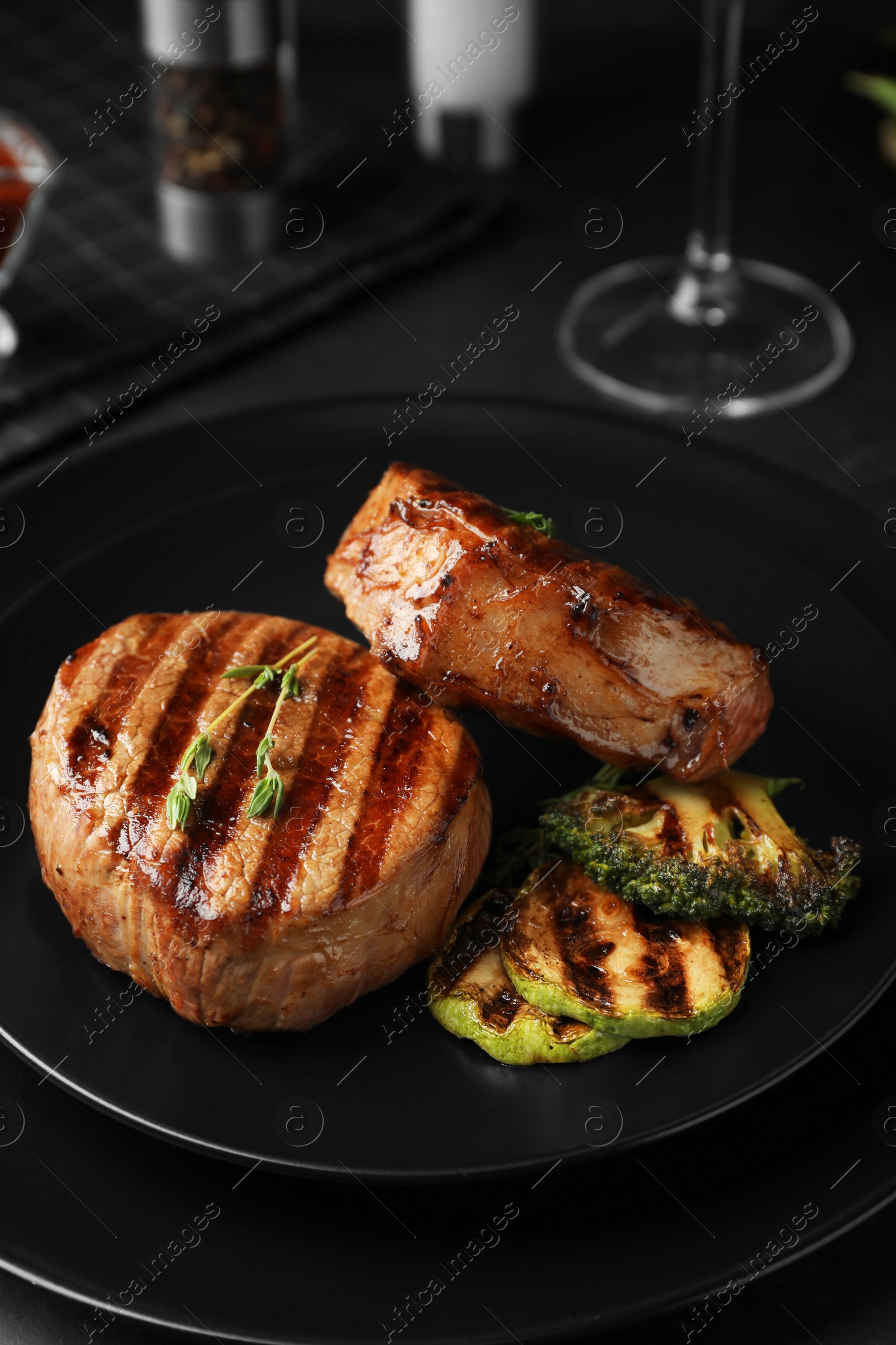 Photo of Delicious beef medallions served on table, closeup