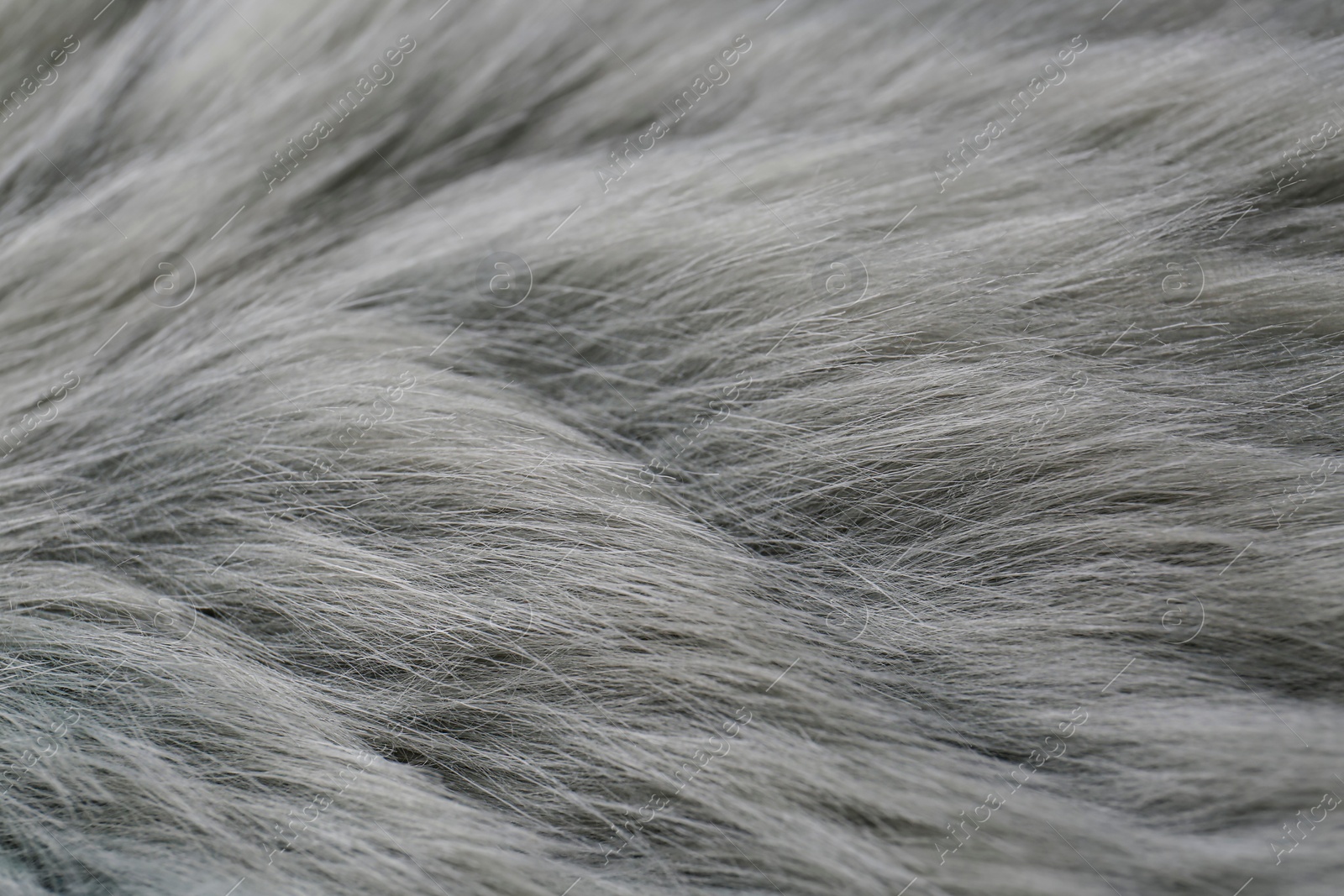 Photo of Grey faux fur as background, closeup view