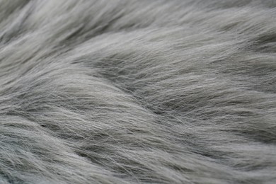 Grey faux fur as background, closeup view