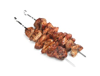Metal skewers with delicious shish kebabs isolated on white
