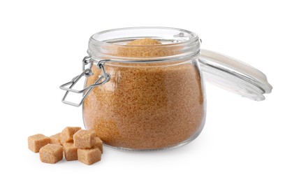 Photo of Granulated and cubed brown sugar with jar on white background
