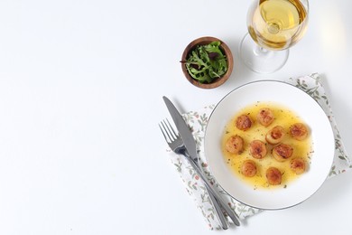 Photo of Delicious fried scallops served on white table