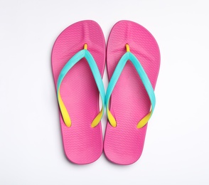 Pair of flip flops on white background, top view. Beach accessories