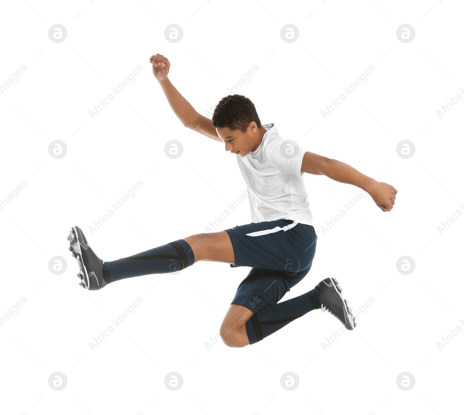 Photo of Teenage African-American boy playing football on white background