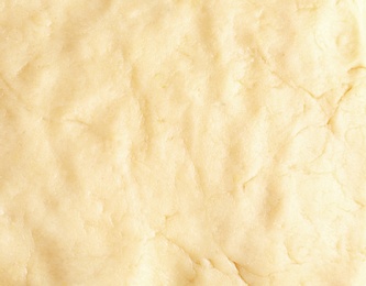 Photo of Fresh raw dough as background