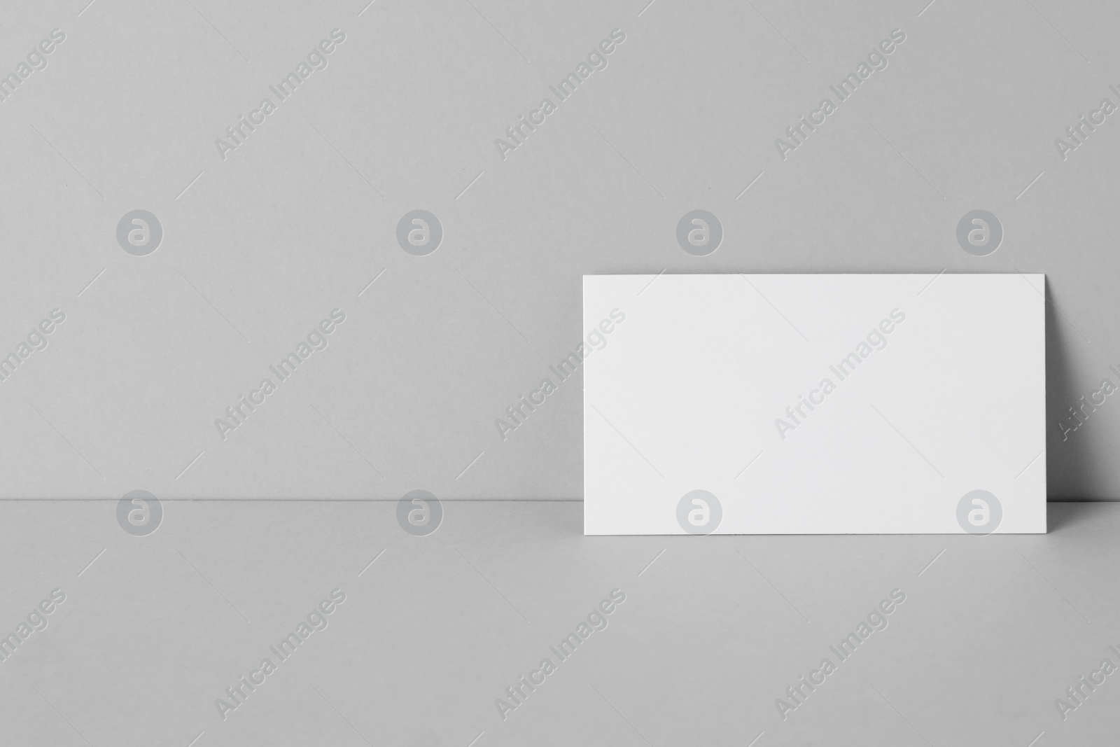 Photo of Blank business card on light grey background. Mockup for design