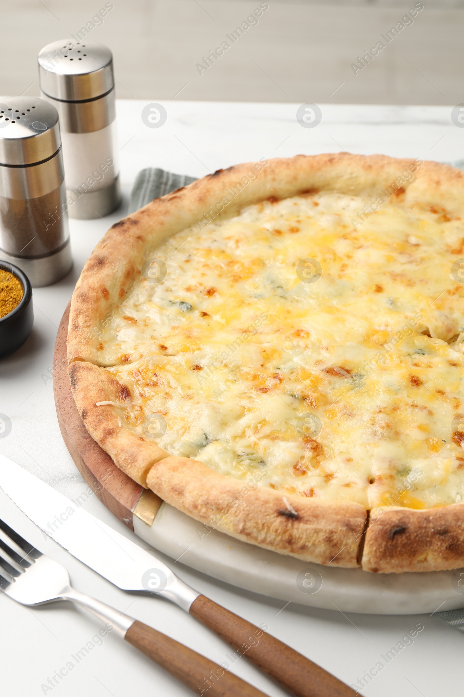 Photo of Delicious cheese pizza served on white table