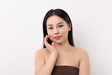 Portrait of beautiful woman on white background