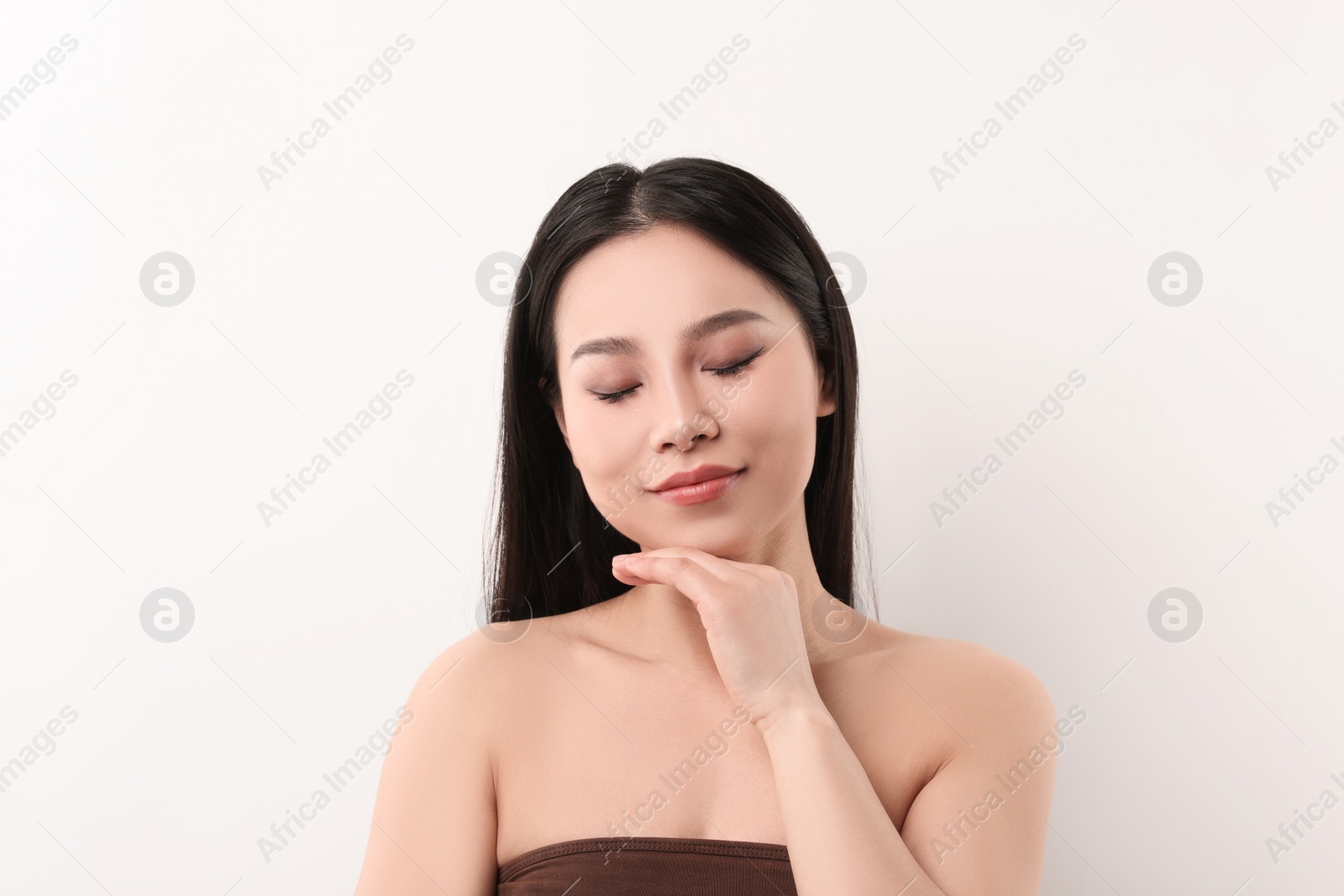 Photo of Portrait of beautiful woman on white background