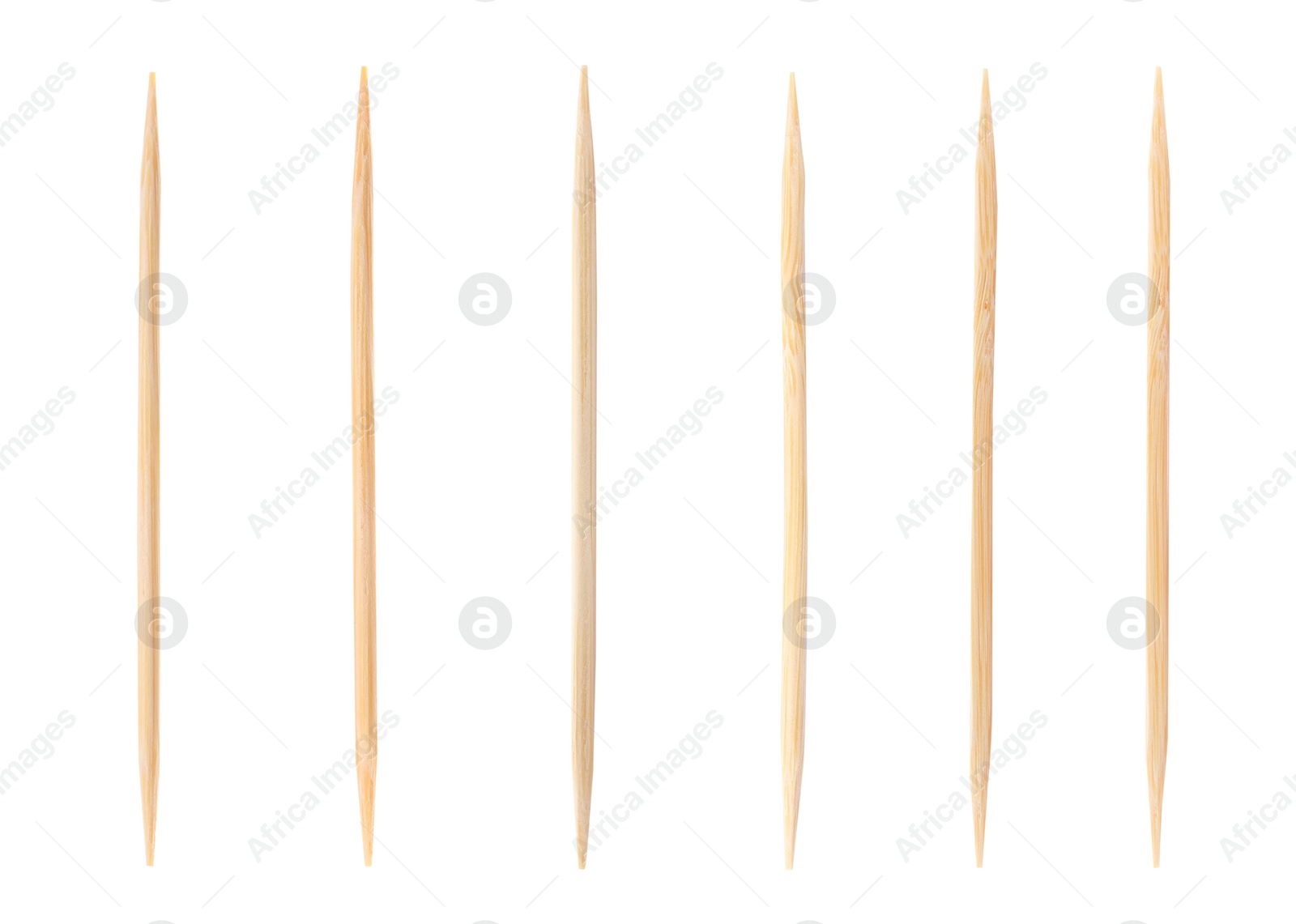 Image of Set with wooden toothpicks on white background