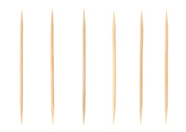 Image of Set with wooden toothpicks on white background