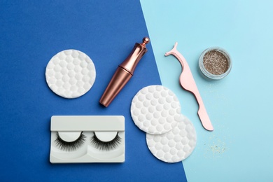 Flat lay composition with magnetic eyelashes and accessories on color background