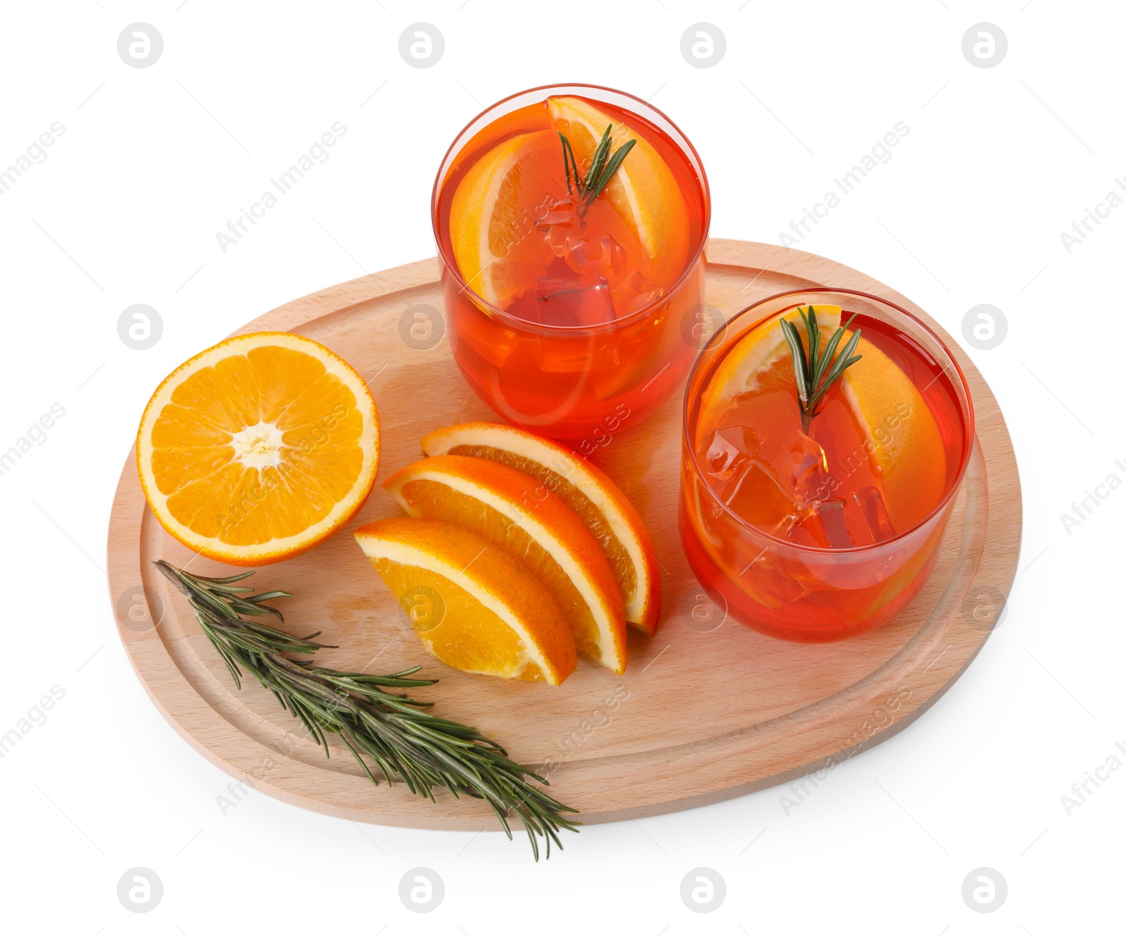 Photo of Aperol spritz cocktail in glasses, orange slices and rosemary isolated on white