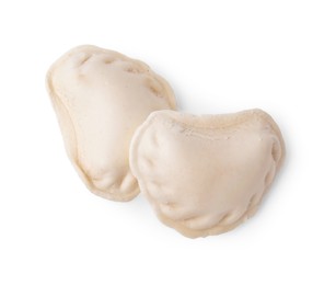 Photo of Raw dumplings (varenyky) with tasty filling on white background, top view