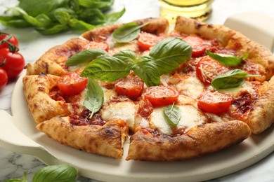 Delicious Margherita pizza on white marble table, closeup