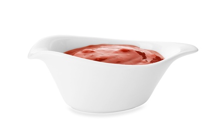Photo of Gravy boat with spicy chili sauce on white background