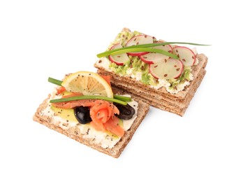 Photo of Fresh crunchy crispbreads with cream cheese, salmon, olives, lemon, radish green onion on white background