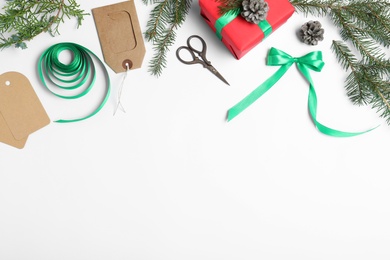 Photo of Composition with Christmas gift and festive decoration on white background, top view