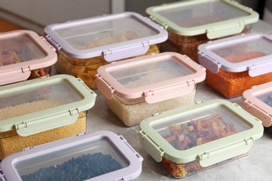 Photo of Many boxes with different food on table