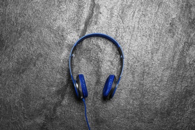 Photo of Stylish headphones on grey background, top view