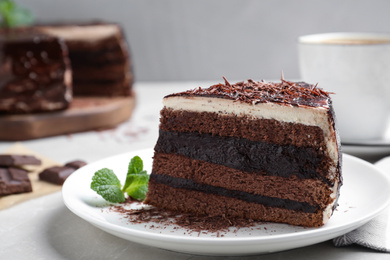 Tasty chocolate cake served on table, closeup