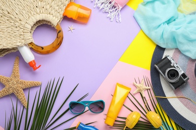 Photo of Flat lay composition with beach accessories on colorful background, space for text