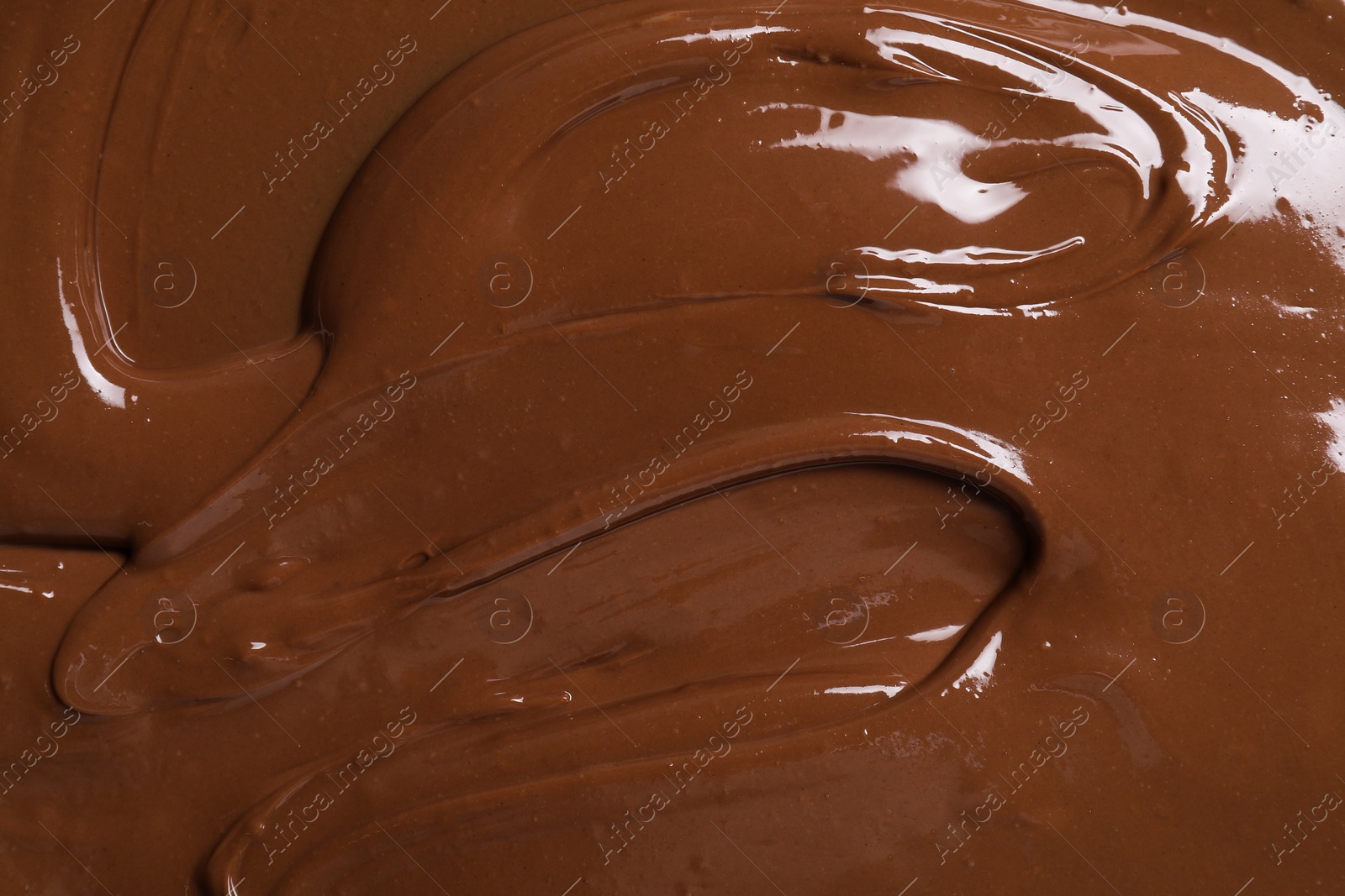 Photo of Tasty chocolate paste as background, closeup view