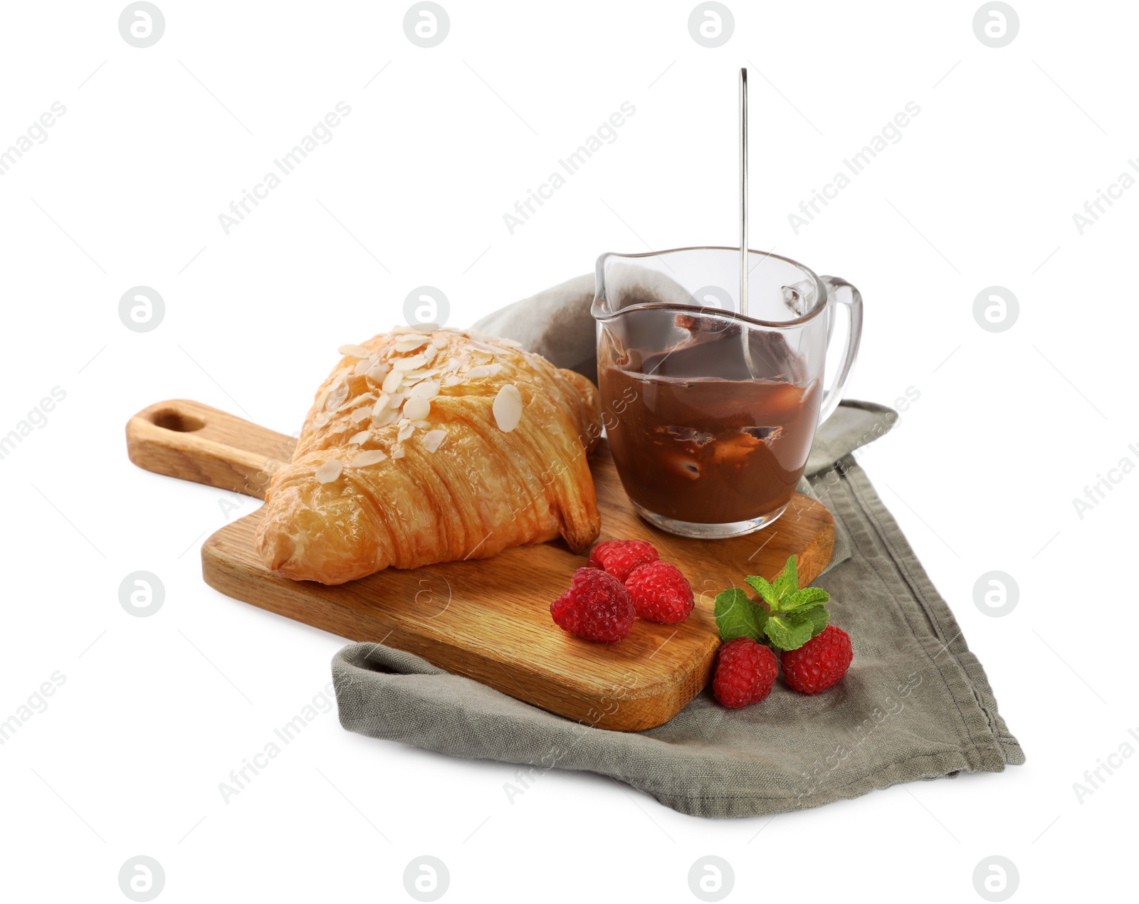 Photo of Delicious croissant with almond flakes, chocolate and raspberries isolated on white