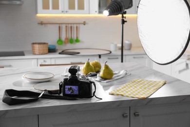 Photo of Professional equipment and many pears on table in kitchen. Food photo