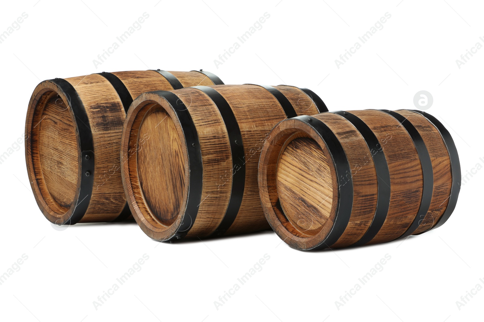 Photo of Three traditional wooden barrels on white background