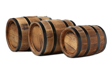 Three traditional wooden barrels on white background